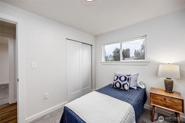 bedroom featuring carpet floors, a closet, and baseboards