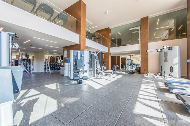 workout area with a high ceiling