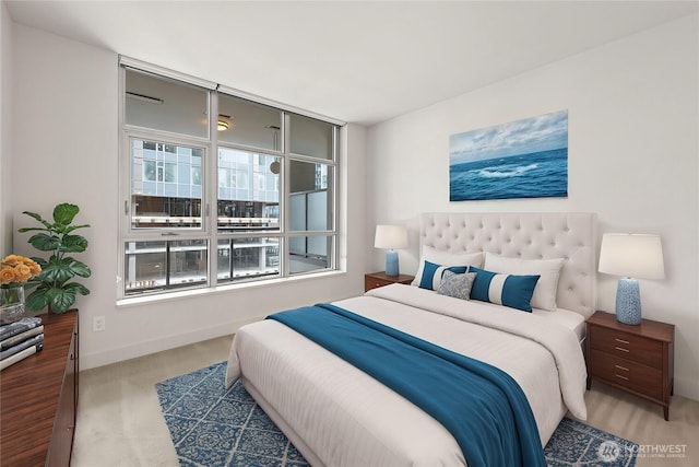 bedroom featuring carpet floors and baseboards