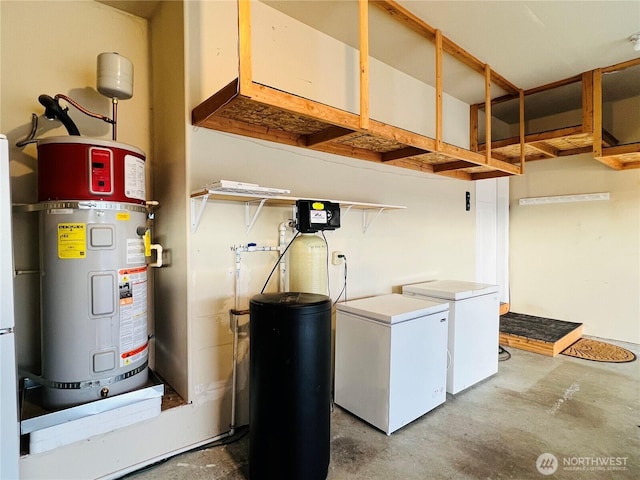 clothes washing area with independent washer and dryer, laundry area, and water heater