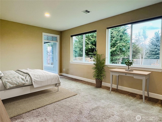 bedroom with baseboards, visible vents, and carpet floors