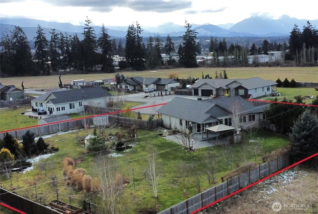 bird's eye view featuring a mountain view and a residential view