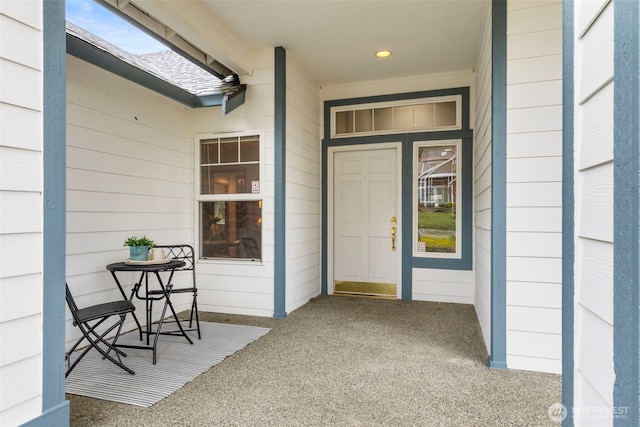 entrance to property featuring a porch