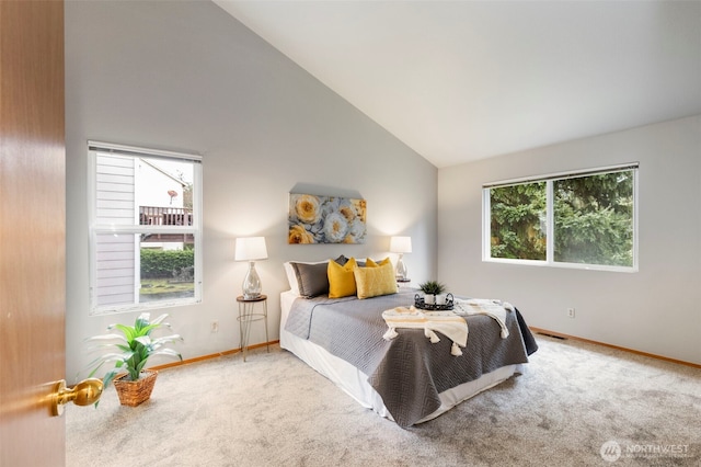 bedroom with carpet flooring, baseboards, and multiple windows