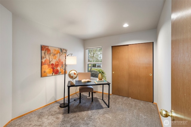 home office with baseboards and carpet flooring