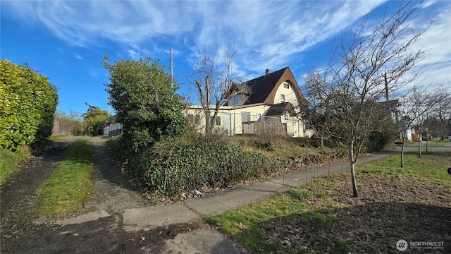 view of side of property with fence