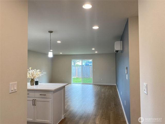 3601 Page St, Port Angeles, WA 98362 - unfurnished room featuring an AC wall unit, dark wood-type flooring, and recessed lighting