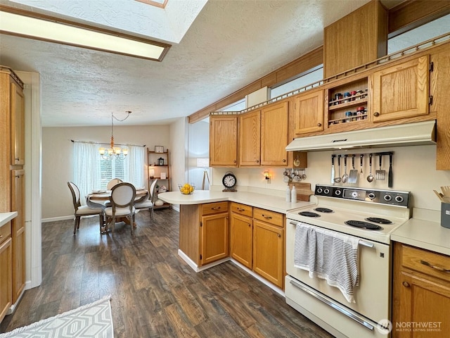 kitchen with white electric range oven, light countertops, vaulted ceiling, a peninsula, and under cabinet range hood