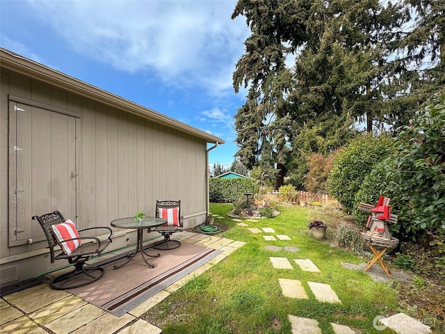 view of yard with a patio and fence