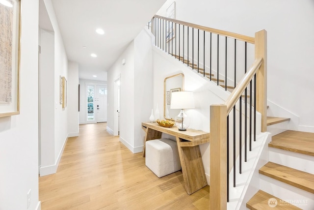 interior space featuring baseboards, wood finished floors, and recessed lighting