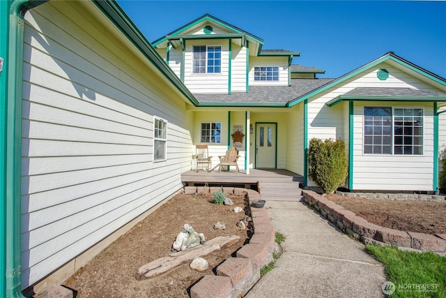 view of front of house featuring a porch and a shingled roof