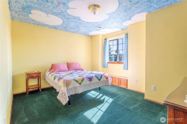 bedroom featuring carpet floors and baseboards