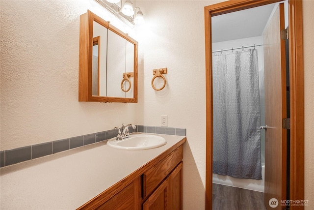 bathroom with vanity and a shower with curtain