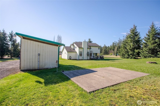 view of yard with an outbuilding and a storage shed