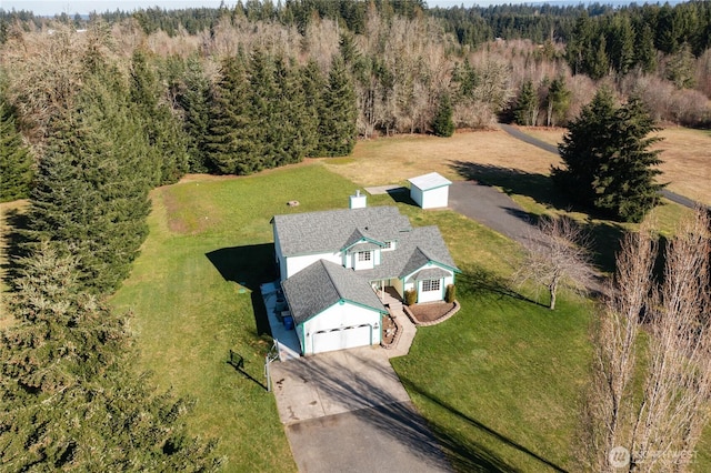 aerial view with a wooded view