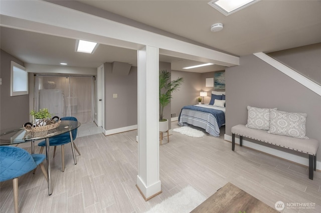 interior space with light wood-type flooring and baseboards