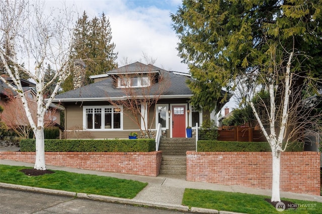 bungalow-style house featuring a shingled roof