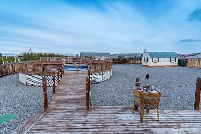 view of dock featuring a fenced backyard