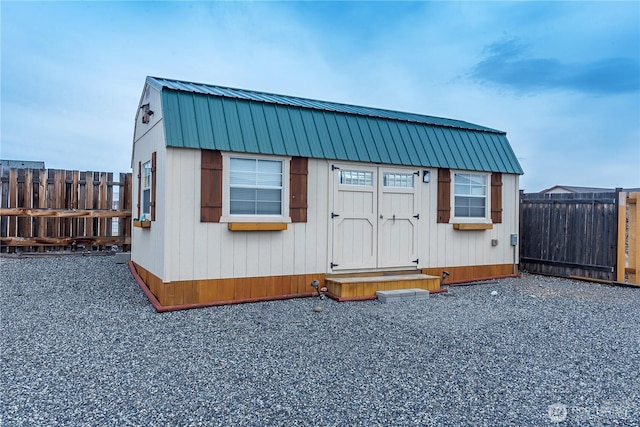 view of outbuilding featuring an outdoor structure and a fenced backyard