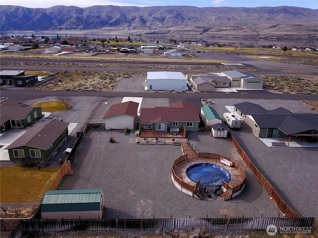 aerial view featuring a mountain view and a residential view