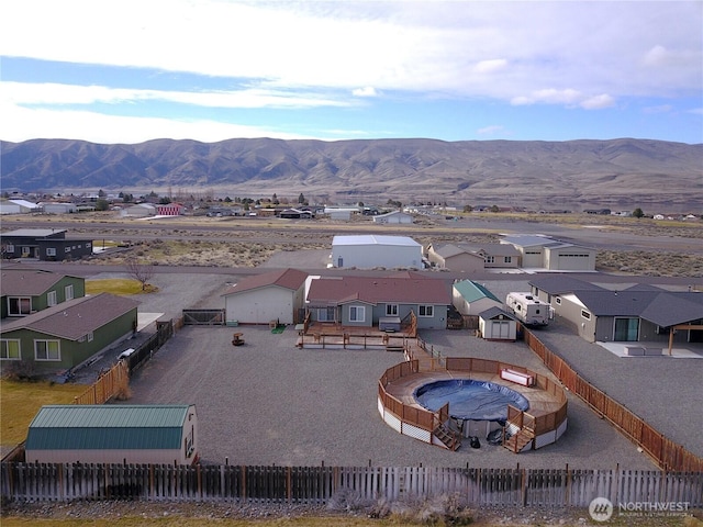 drone / aerial view featuring a mountain view and a residential view