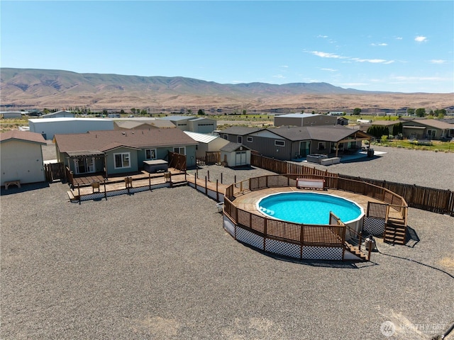 410 Airport Way SW, Mattawa, WA 99349 - view of swimming pool featuring a fenced backyard, a residential view, and a mountain view