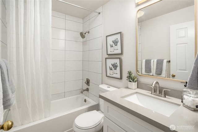 full bathroom featuring shower / bath combination with curtain, vanity, and toilet