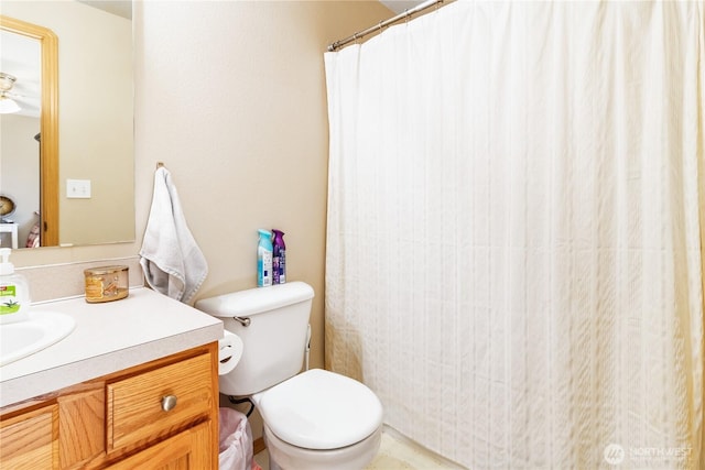 full bath featuring toilet, a shower with curtain, and vanity