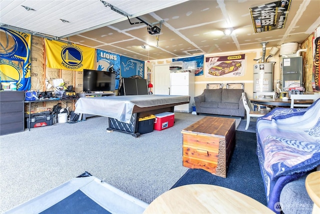 interior space featuring a garage door opener, freestanding refrigerator, and water heater