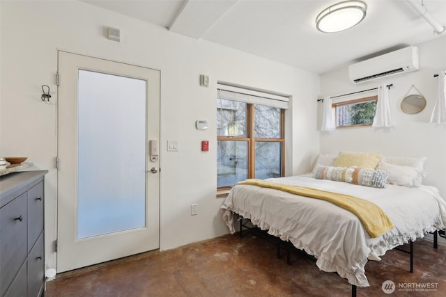 bedroom featuring a wall mounted air conditioner and concrete floors