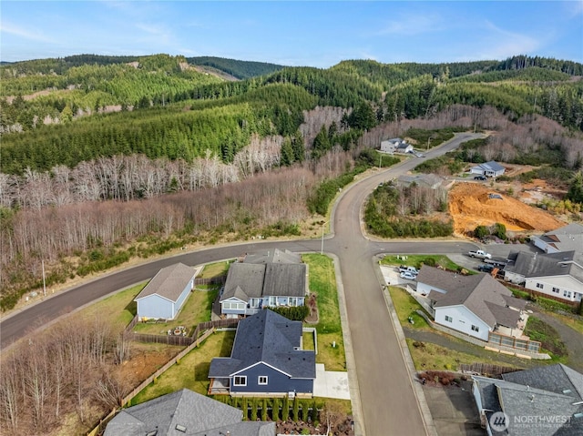 bird's eye view with a residential view and a view of trees