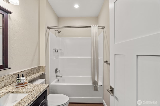 full bath featuring vanity, toilet, and washtub / shower combination