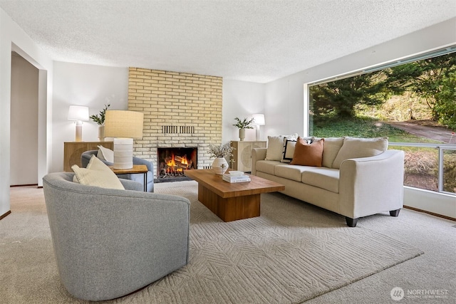 carpeted living room with a textured ceiling and a fireplace