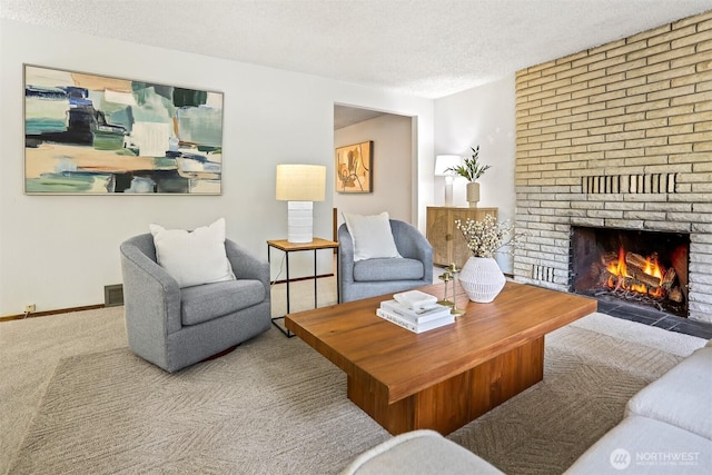 carpeted living area with visible vents, baseboards, a textured ceiling, and a fireplace