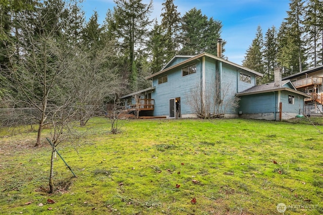 exterior space featuring a deck and a yard