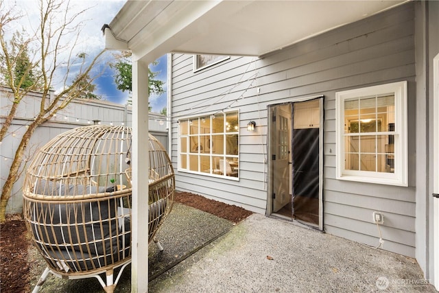 exterior space with fence and a patio