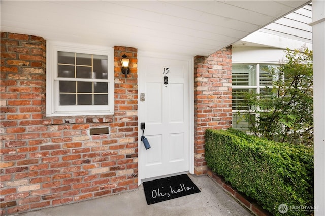 entrance to property with brick siding