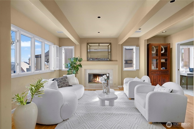 living room with a tile fireplace