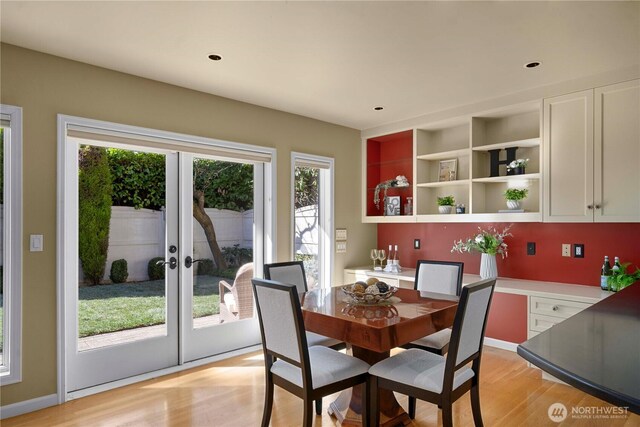 dining area featuring recessed lighting, french doors, and light wood-type flooring