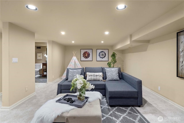 living room featuring recessed lighting, baseboards, and carpet