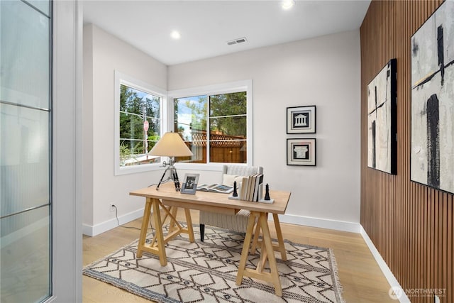 home office with recessed lighting, visible vents, light wood-style flooring, and baseboards