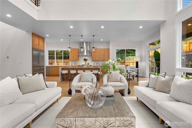 living room featuring recessed lighting and light wood-style floors