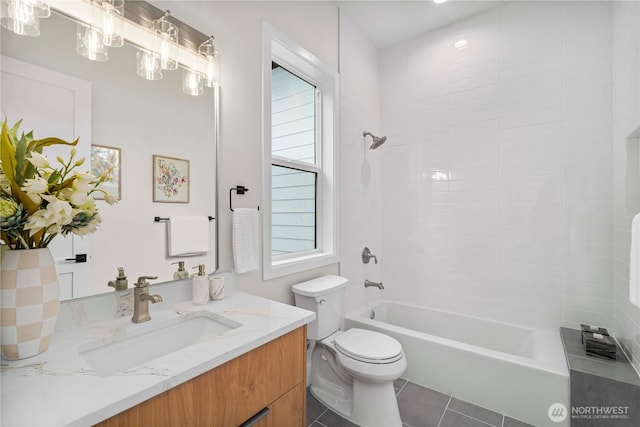 bathroom featuring toilet, shower / washtub combination, vanity, and tile patterned flooring