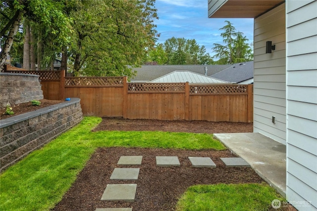 view of yard with a fenced backyard