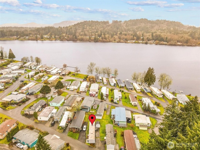 bird's eye view featuring a water view and a residential view