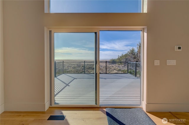 entryway featuring wood finished floors and visible vents