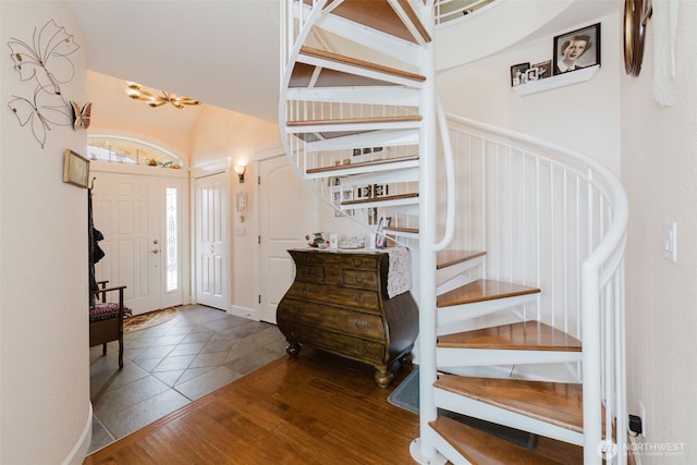 foyer entrance with stairway and wood finished floors