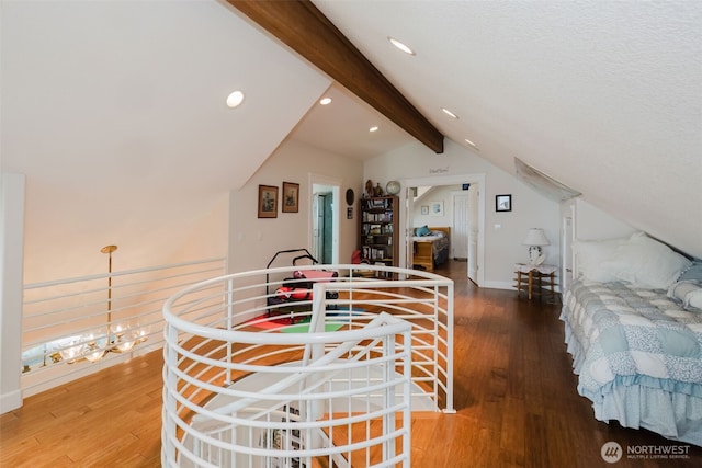 dining room featuring vaulted ceiling with beams, baseboards, wood finished floors, and recessed lighting