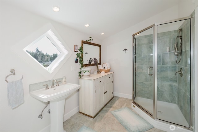 bathroom with baseboards, a stall shower, a skylight, and recessed lighting