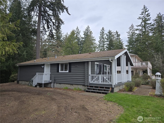 view of front facade with crawl space and log veneer siding